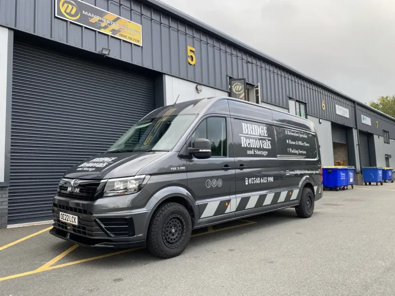 Bridge Removals van, freshly liveried for office clearance jobs, at the Manchester signage unit that applied it.
