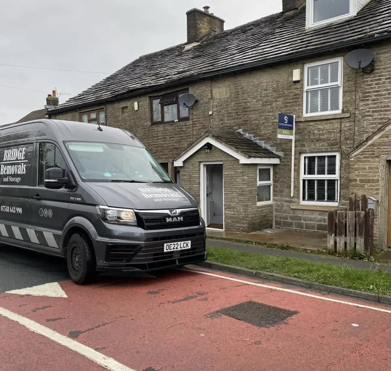 Bridge Removals van outside stone terrace cottages on a house removals job.