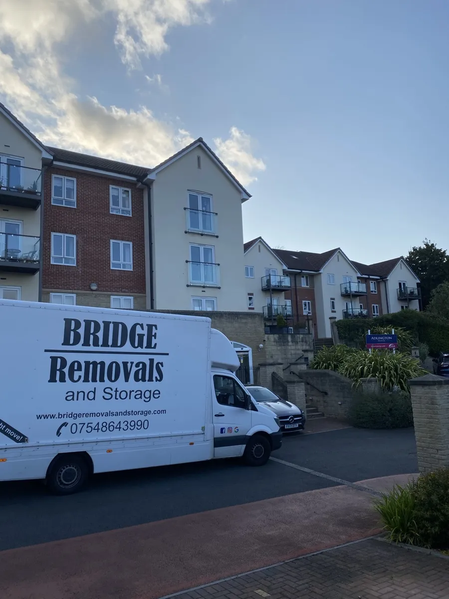 Evening Move To Retirement Apartments Bridge Removals van outside Adlington House retirement apartments on an evening long-distance removals move.