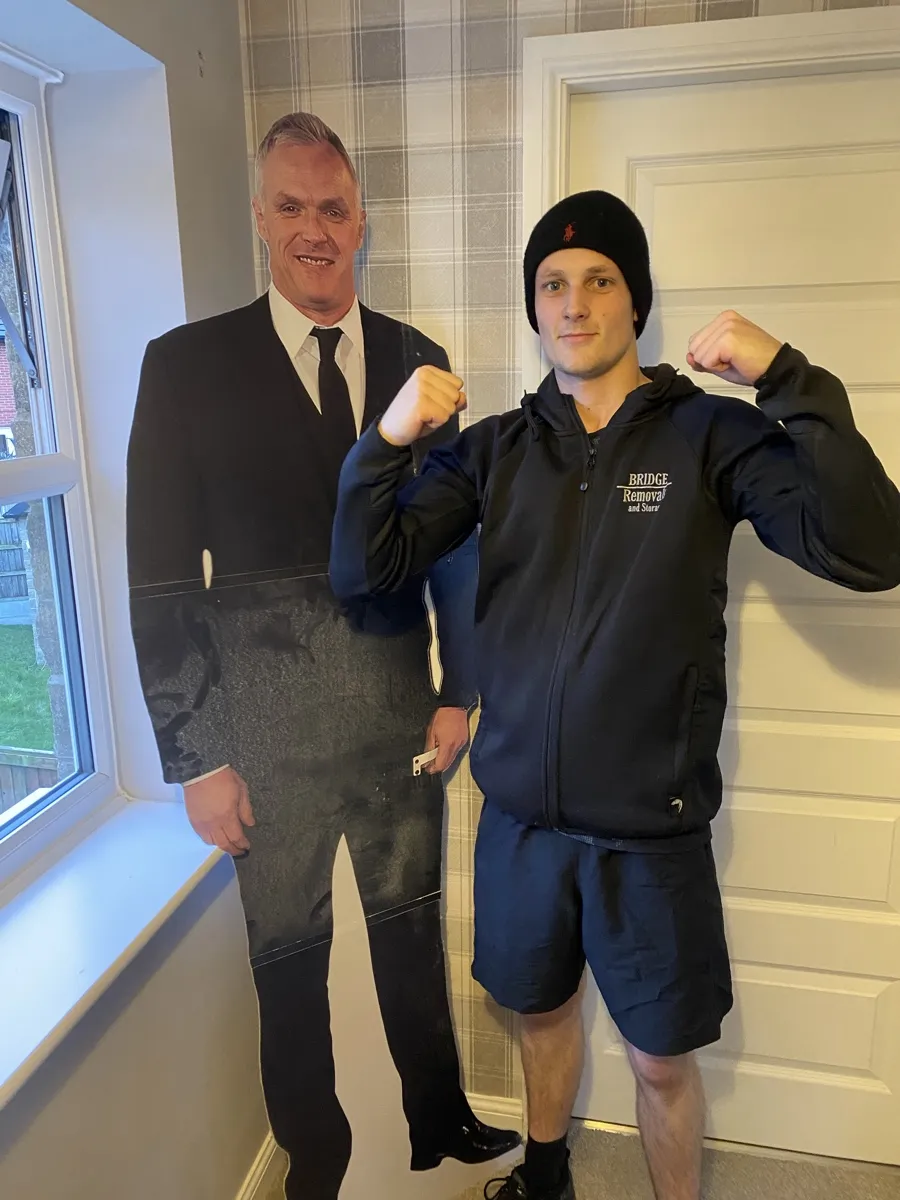 House Removals Meets a Life-Size Cutout Bridge Removals crew member poses with a life-size cardboard cutout on a house removals job.
