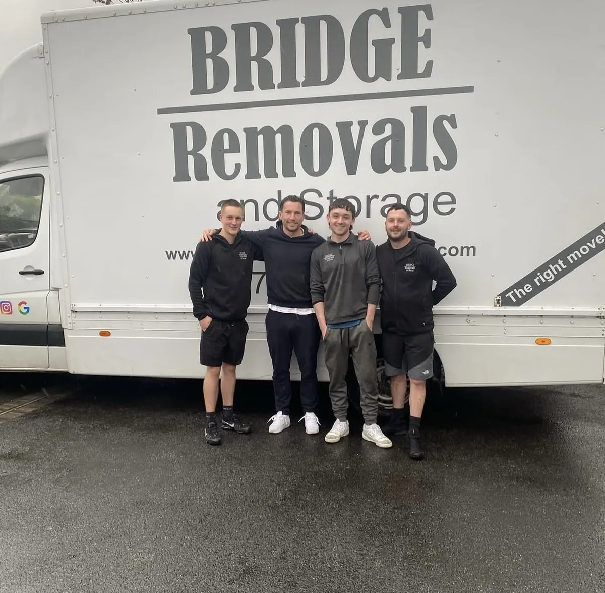 The Bridge Removals Team After A Job Bridge Removals crew standing beside the van's ‘The right move’ livery after a house removals job.