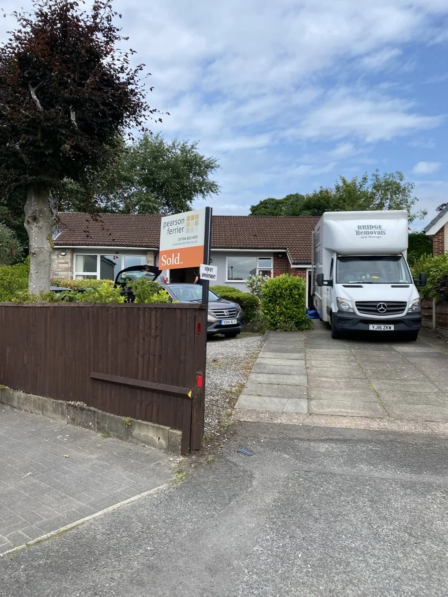 Summerseat Dormer Bungalow Sold Move Bridge Removals van at a dormer bungalow in Summerseat with a SOLD board up, on a house removals job.