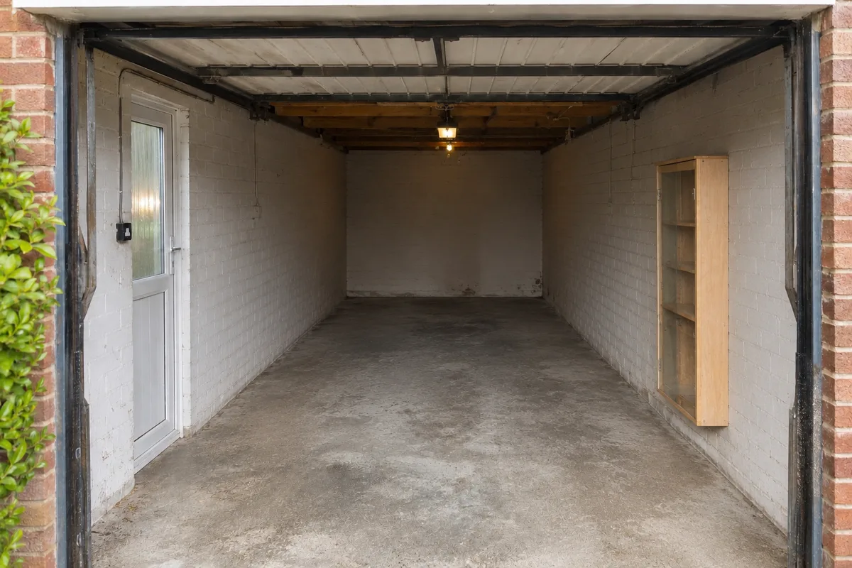 The same garage cleared and empty after Bridge moves everything into storage The same garage cleared and empty after Bridge moves everything into storage