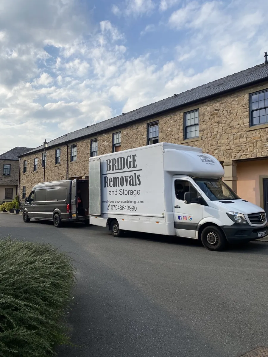 Bridge Removals van outside a long stone terrace in Horwich