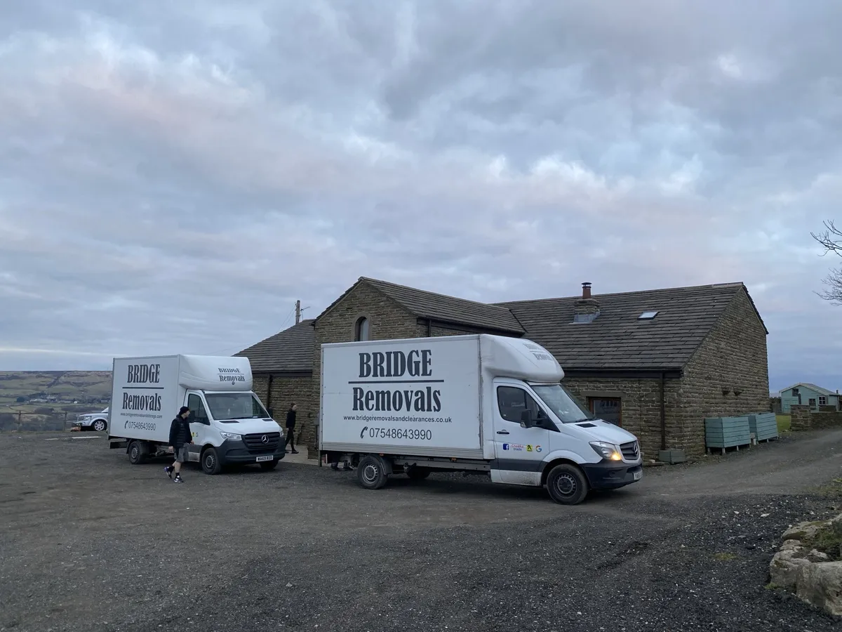 Waterfoot Hilltop Valley View Move Bridge Removals vans at a hilltop stone barn overlooking the Waterfoot valley on a house removals job.