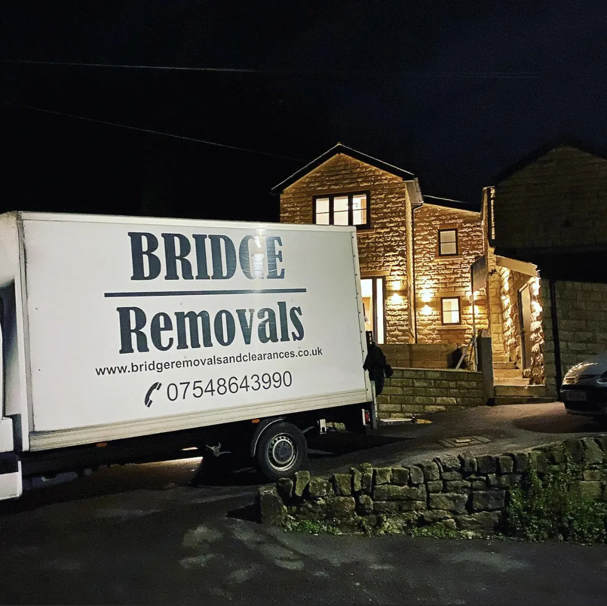 Late Night House Removal Job Bridge Removals van outside a stone house at night, the last stop on a long house removals day.
