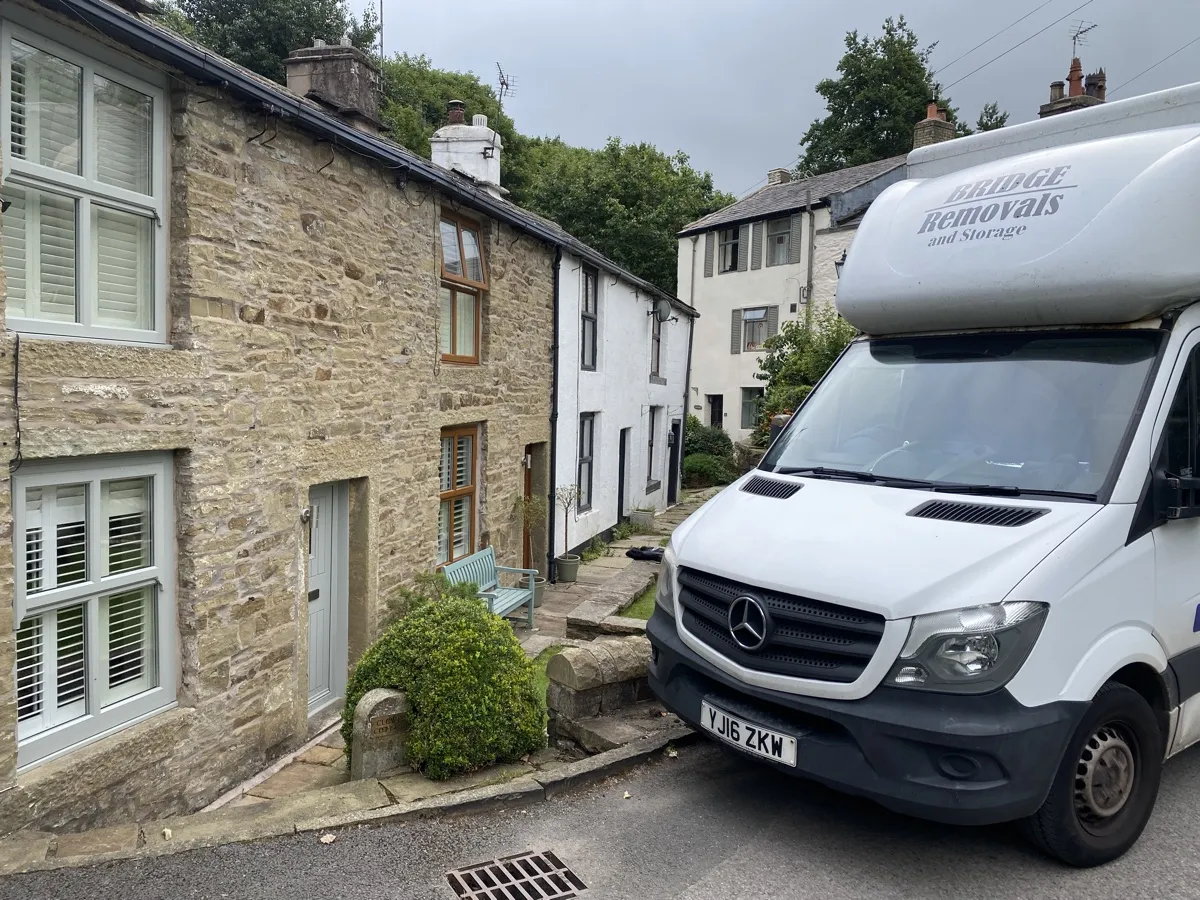 Ewood Bridge Narrow Lane House Move Bridge Removals van squeezing down a narrow lane between stone cottages in Ewood Bridge on a house removals job.