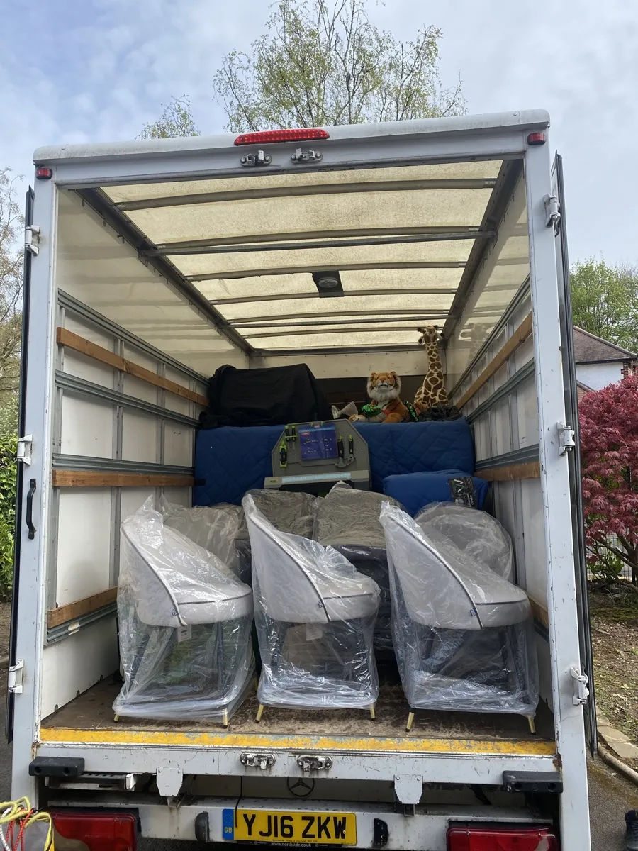 Furniture Removals with Every Piece Wrapped Bridge Removals van loaded with clear-wrapped armchairs and plush toys tucked in, ready for furniture removals.