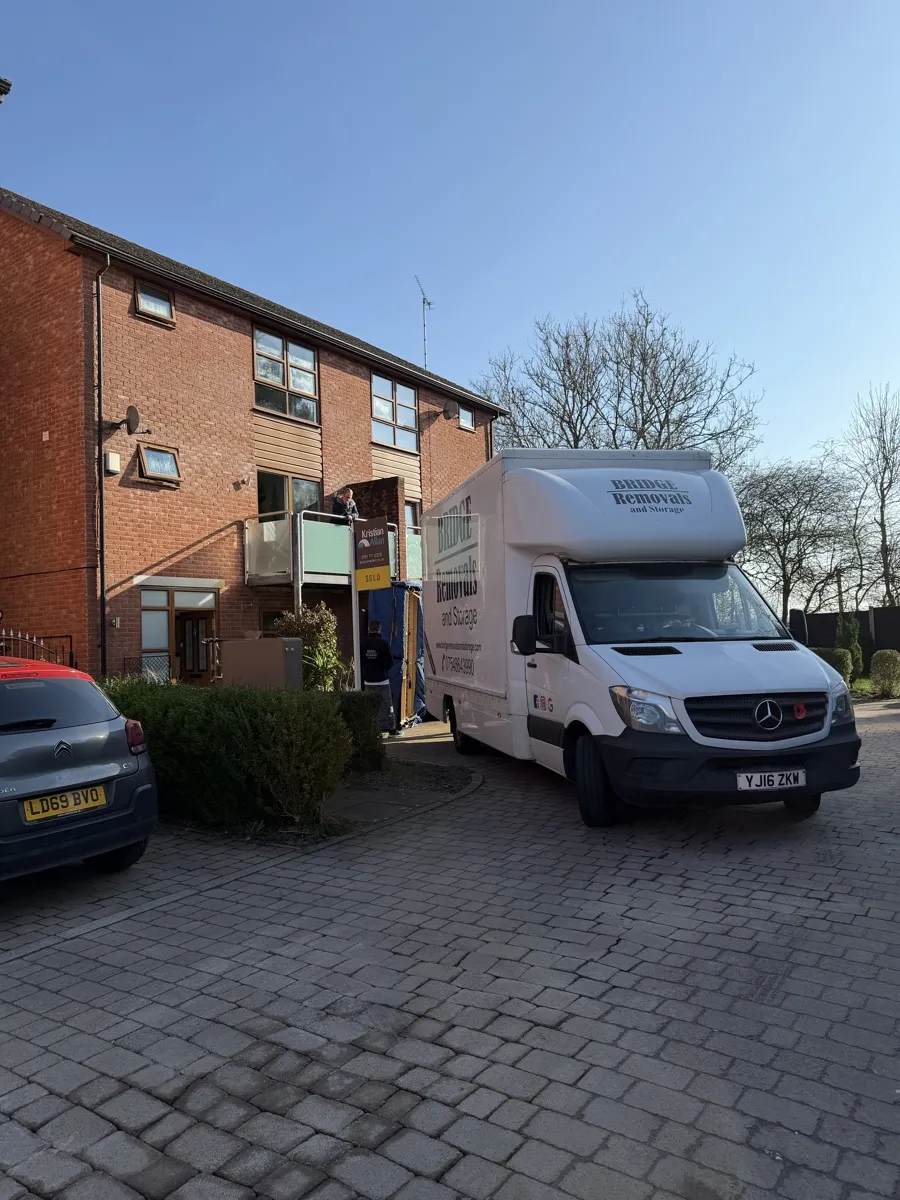 Summerseat Townhouse Moving Day Bridge Removals van backed onto the driveway of a red brick townhouse in Summerseat during a house removals job.